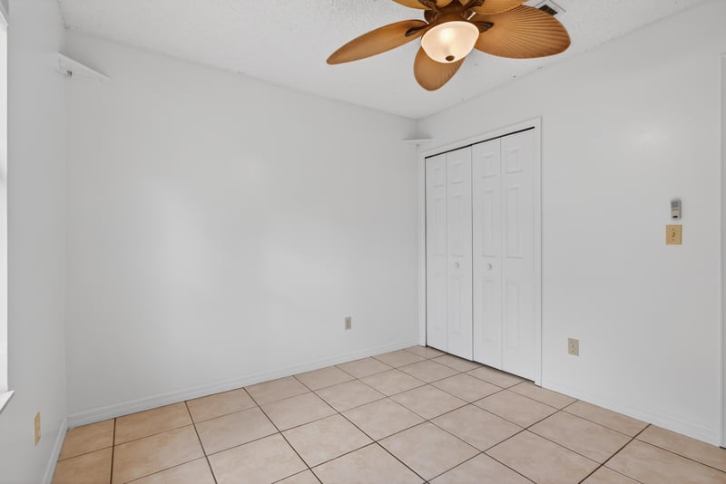 Bedroom with tile floor and closet at 2164 Orangewood St, Middleburg, FL 32068