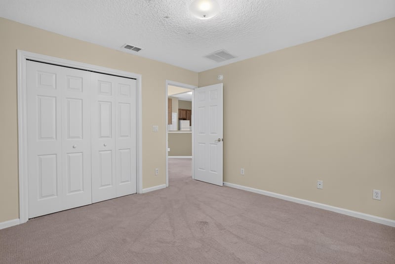 Bedroom closet with bifold doors at 299 John's Creek Pkwy, St. Augustine, FL 32092