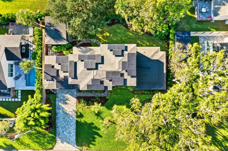 Aerial view of the home's roofline and backyard at 722 3rd Ave N, Jacksonville Beach, FL