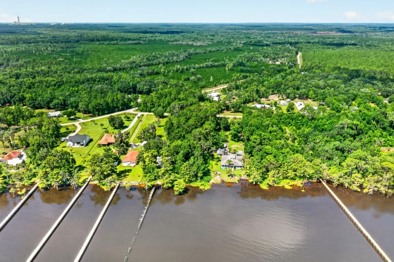 Aerial view of the river shoreline with docks near the property at 110 River Shores Rd, Palatka, FL 32043