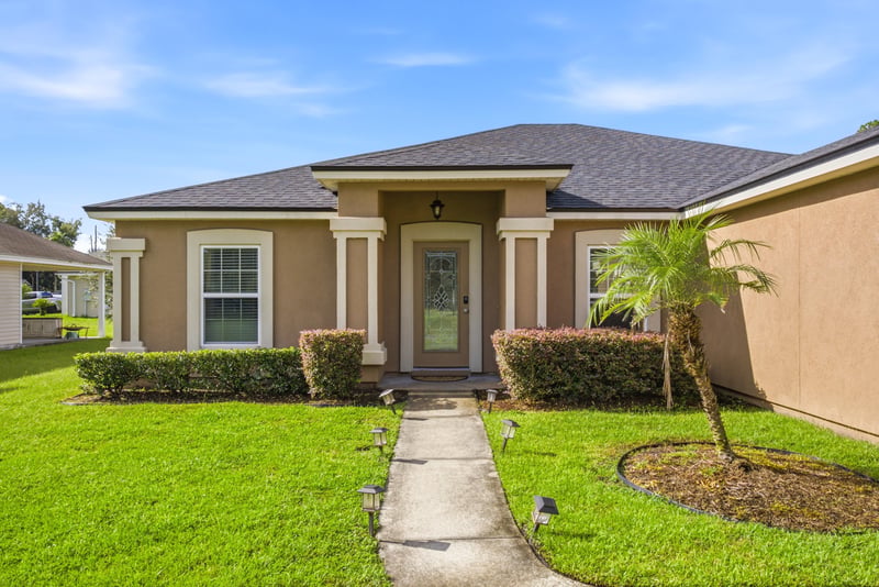 Front entry walkway with tile roof at 7392 Timber Falls Ct