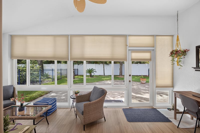 Sunroom with large windows and natural light at 11225 Water Spring Cir, Jacksonville, FL 32256