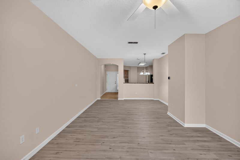 Open living area with stairs and hallway at 3762 Hartsfield Forest Cir, Jacksonville, FL 32277