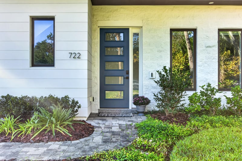 Front door with house number 722 and glass sidelights at 722 3rd Ave N, Jacksonville Beach, FL