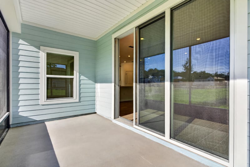 Furnished screened porch seating area at 269 Bluegrass Wy, St. Augustine, FL 32092