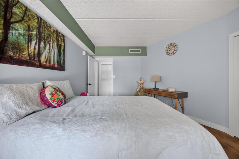 Bedroom with artwork and wood flooring at 2280 Shepard St