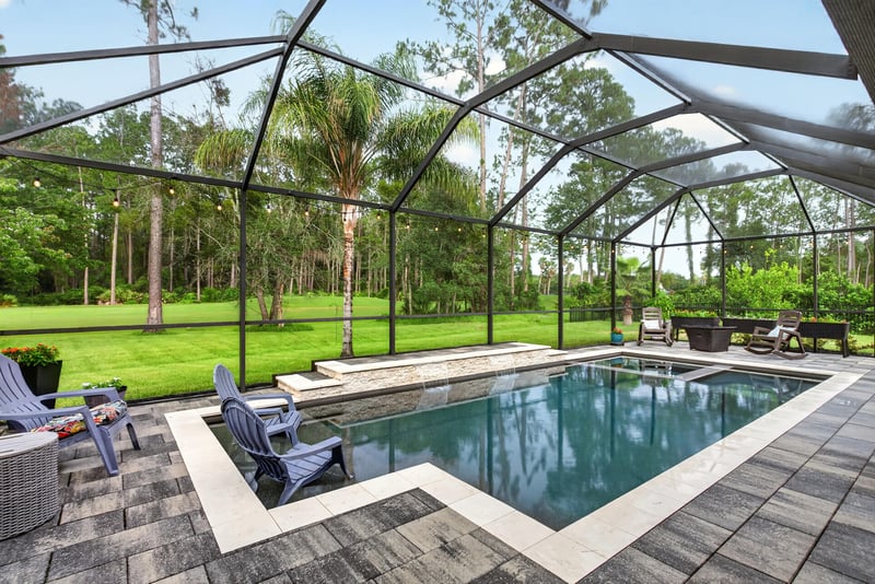 Screened pool and wood deck patio at 2304 Spring Hill Ct, Orange Park, FL