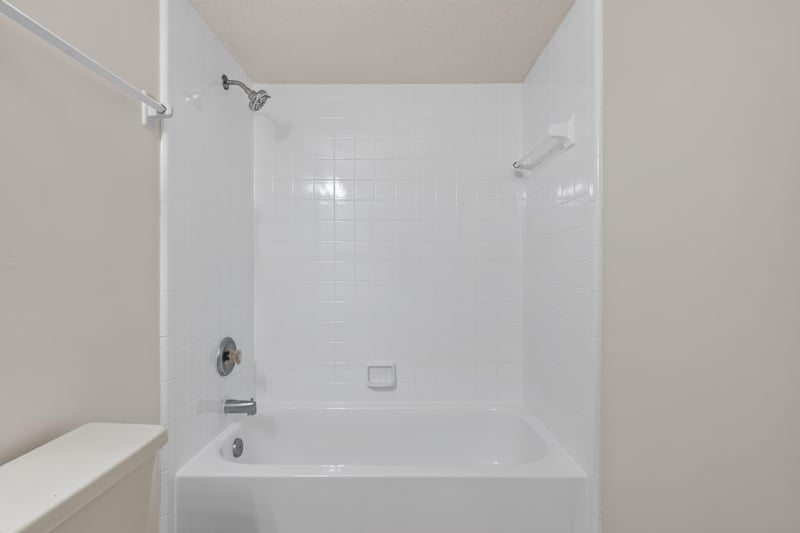 Bathroom tub and shower combo at 1445 Classic Oak Rd W, Jacksonville, FL