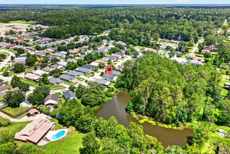 Drone aerial of rooftops and tree line in Middleburg, FL
