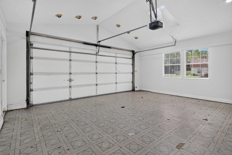 Garage with overhead door and windows at 400 Ashcroft Landing Dr, Jacksonville, FL 32225