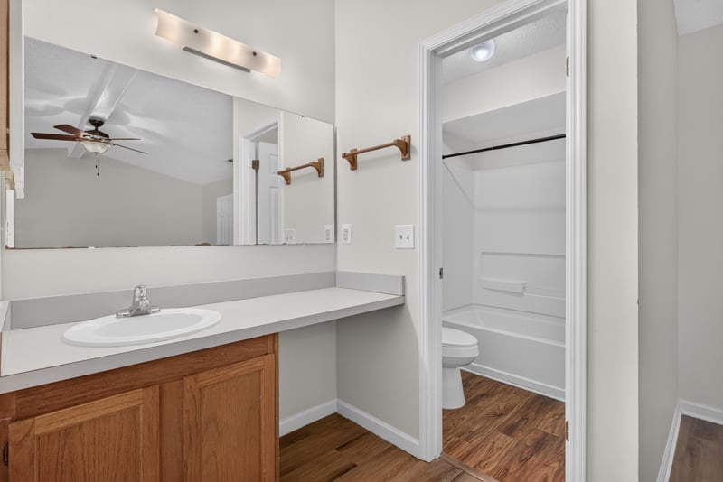 Bathroom dual-sink vanity with mirror at 4427 Millstone Ct, Jacksonville, FL