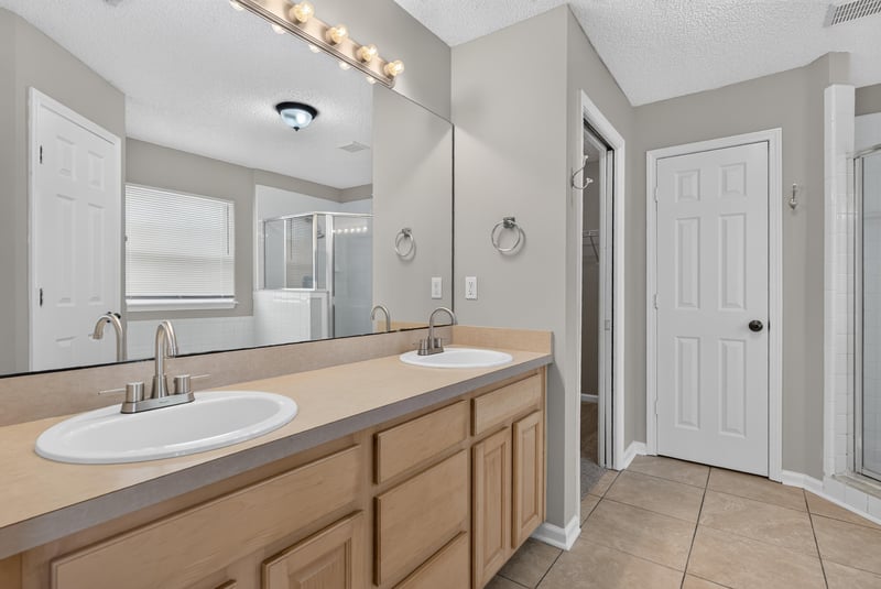 Bathroom with double sink vanity at 12949 Chets Creek Dr S, Jacksonville, FL 32224