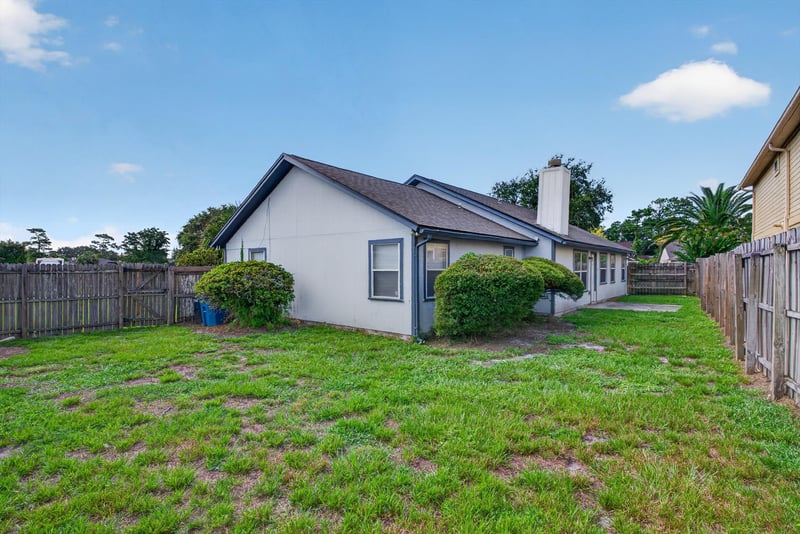 Backyard with open lawn and fence at 400 Ashcroft Landing Dr, Jacksonville, FL 32225