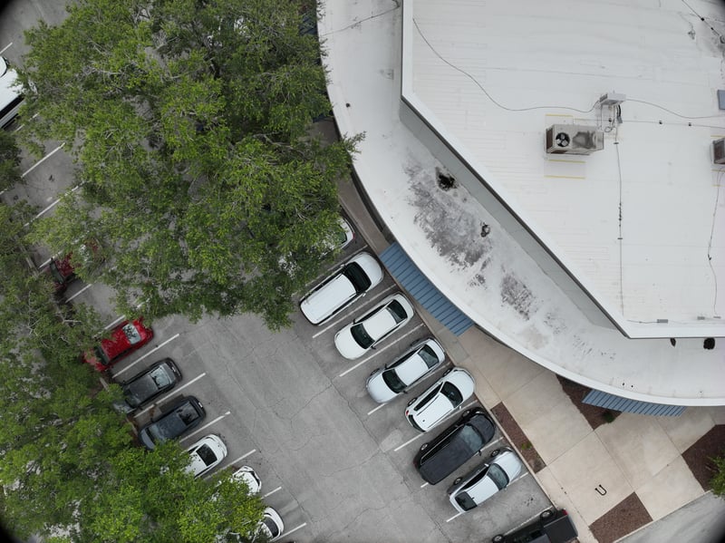 Aerial view of oak trees over parking rows at 9406 Atlantic Blvd, Jacksonville, FL 32225
