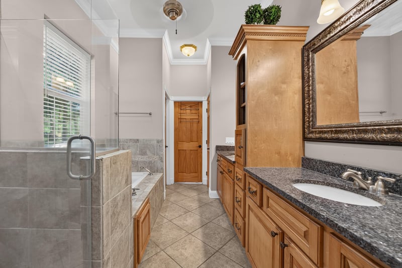 Primary bath with soaking tub and separate shower at 1735 Hagans Ridge Ct