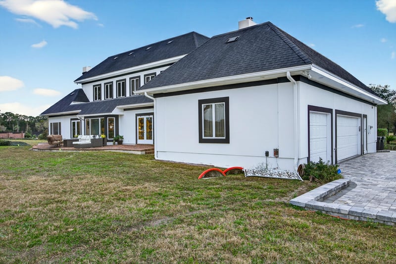 Back Opposite Angle showing garage at 7987 Hollyridge Rd, Jacksonville, FL 32256