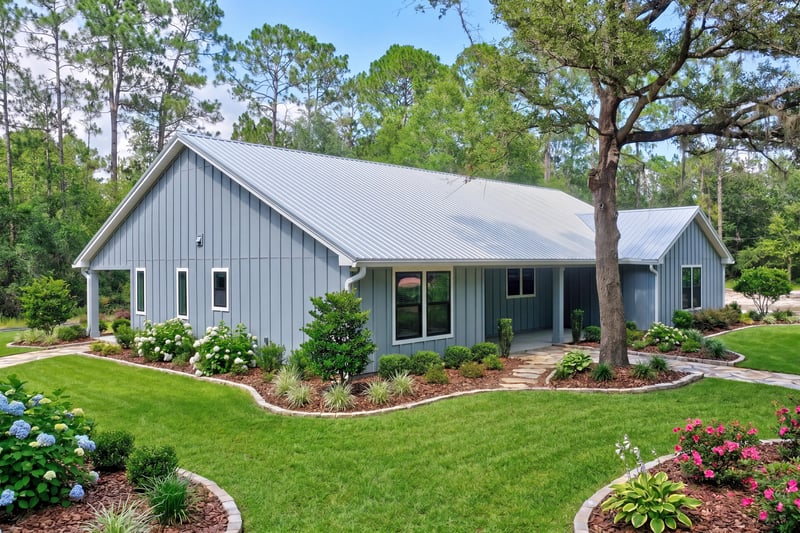Front exterior angled view with board and batten siding at 4800 Acacia St, Middleburg, FL 32068