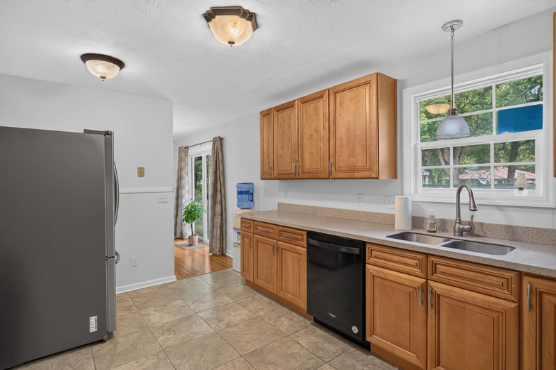 Kitchen with refrigerator and pendant lighting at 1847 Grove Park Dr, Orange Park, FL