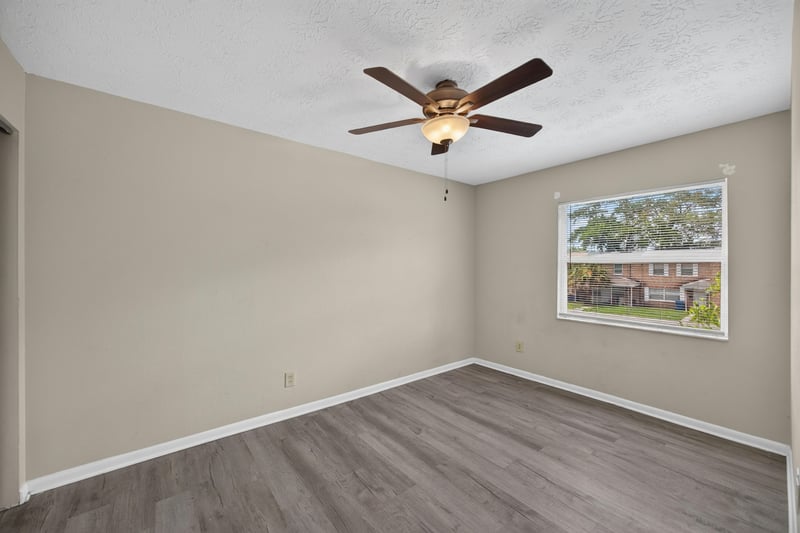 Bedroom with ceiling fan and window at 2658 Trollie Ln apt 1, Jacksonville, FL 32211