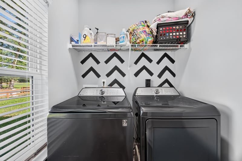 Laundry room with washer, dryer and storage shelf at 2817 Camel Cir, Middleburg, FL