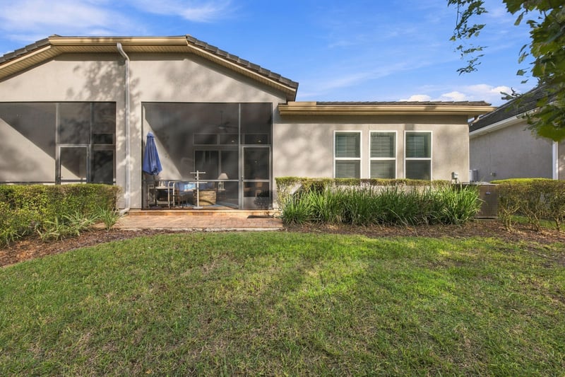 Backyard with screened porch exterior, photographed by Megapixeler on Lucena Ln, Jacksonville, FL