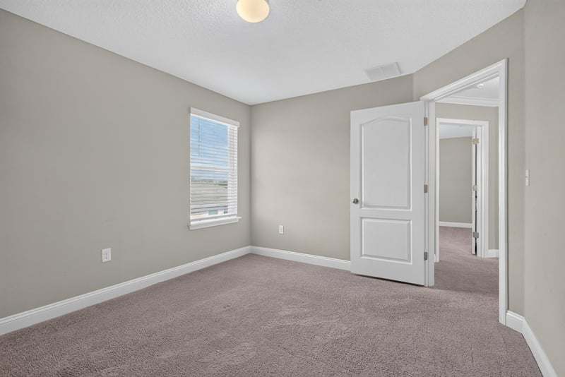 Bedroom with carpet and closet door at 2580 Cold Stream Ln, Green Cove Springs, FL 32043