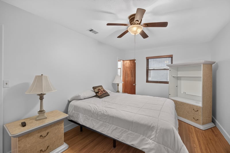 Bedroom with built-in shelf and nightstand at 1847 Grove Park Dr, Orange Park, FL