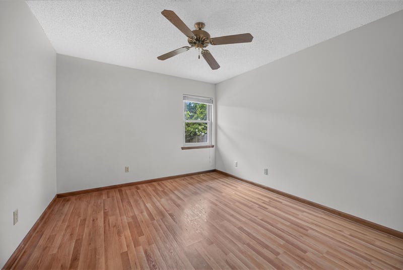 Empty bedroom with wood floor and ceiling fan at 2460 San Sago Ln, Jacksonville, FL