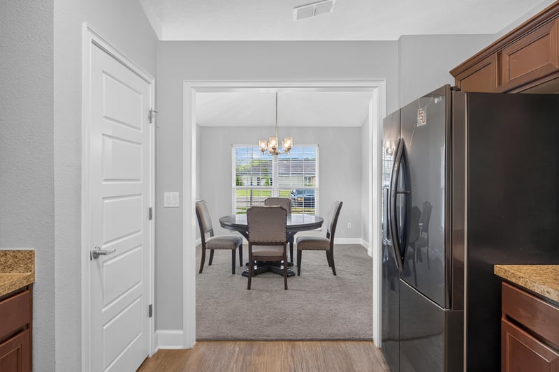 Hallway view toward dining area at 9846 Olivia St, Jacksonville, FL