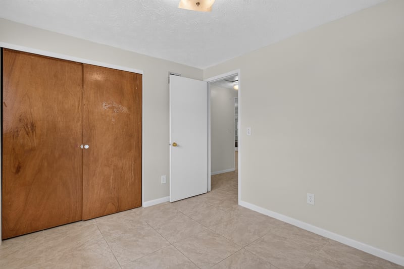 Hallway with closet doors at 9954 Larkdale Ct, Jacksonville, FL 32257