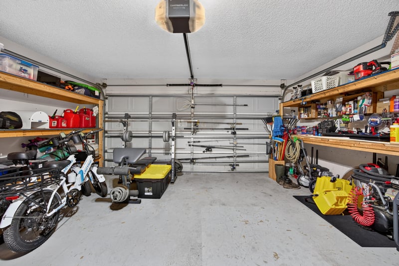 Garage with bikes and tools at 1589 Backwater Drive, Middleburg, FL 32068
