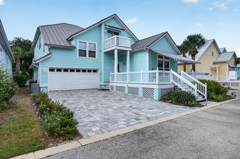 Front exterior with paver driveway at 117 Island Cottage Way, St. Augustine, FL 32080