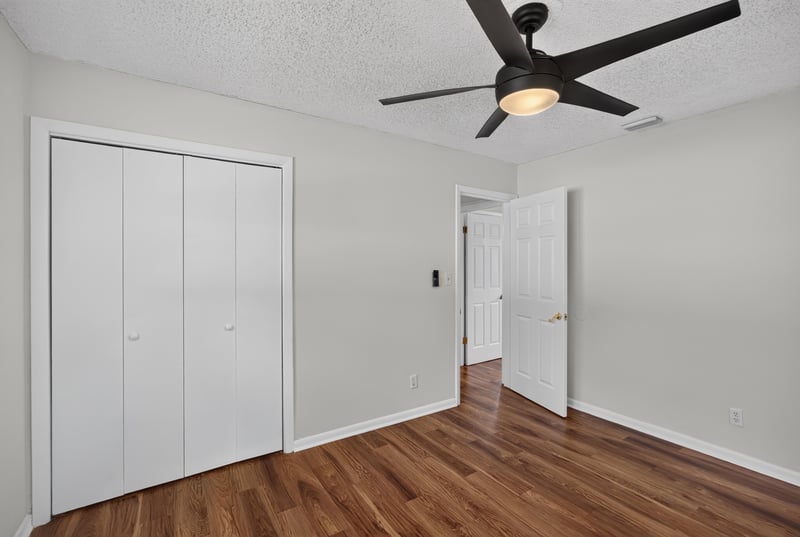 Bedroom with closet doors and ceiling fan at 4039 Habana Ave, Jacksonville, FL