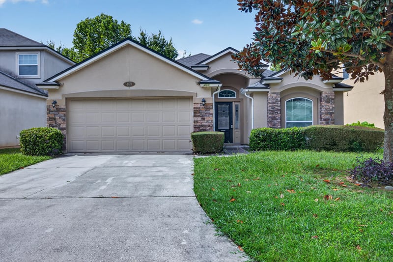Front exterior with garage and driveway at 469 Glendale Ln, Orange Park, FL