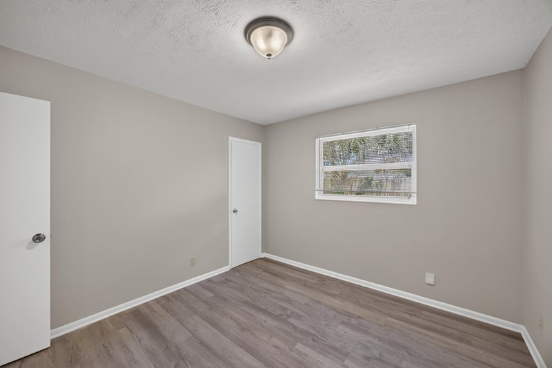 Room with wood-look flooring and window at 5527 Beney Rd, Jacksonville, FL 32207