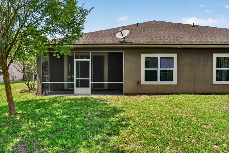 Rear exterior with screened porch at 2378 Caney Oaks Dr, Jacksonville, FL