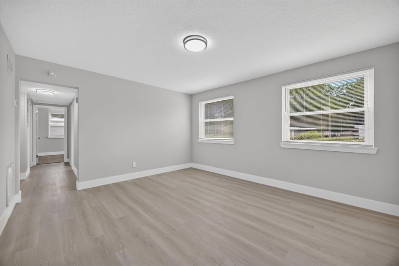 Open living area with wood-look flooring at 6238 Randia Dr, Jacksonville, FL 32210