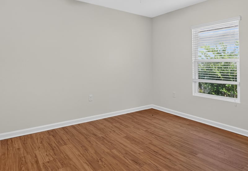 Bedroom with window and wood flooring at 95221 Siena Ct, Fernandina Beach, FL 32034