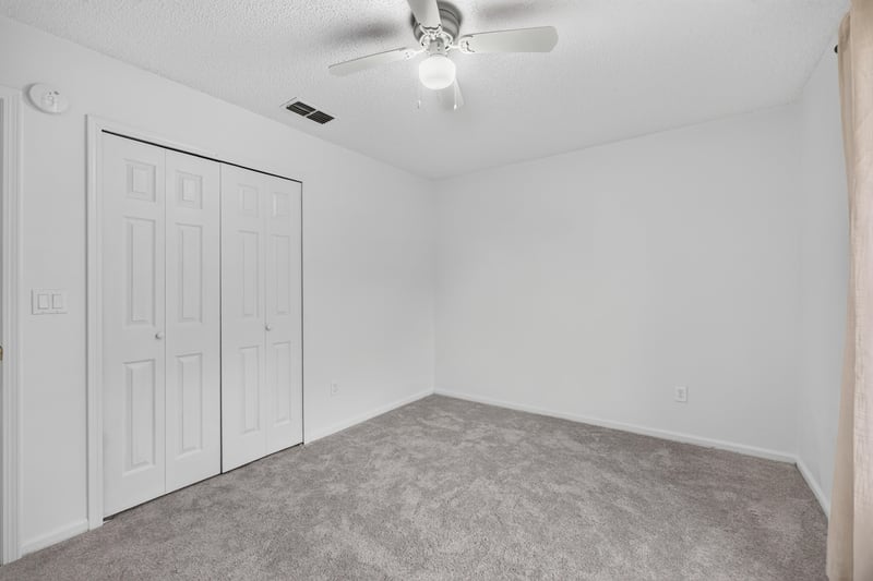 Closet doors in carpeted room at 8921 Needlepoint Pl, Jacksonville, FL 32244