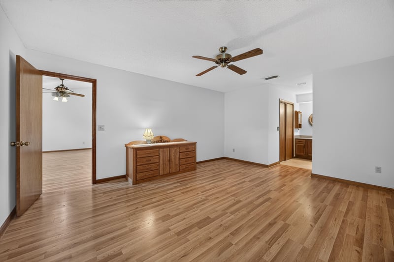 Empty bedroom with wood floor and closet doorway at 2460 San Sago Ln, Jacksonville, FL