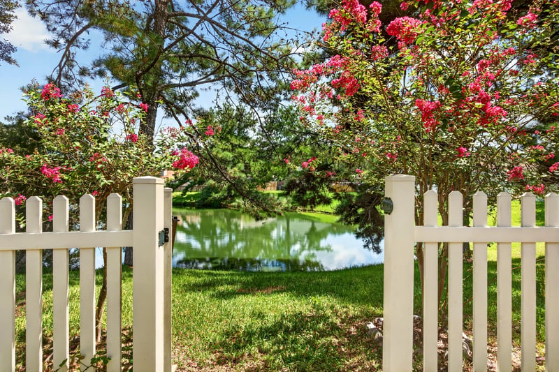 Picket gate with pond view at 1589 Backwater Drive, Middleburg, FL 32068
