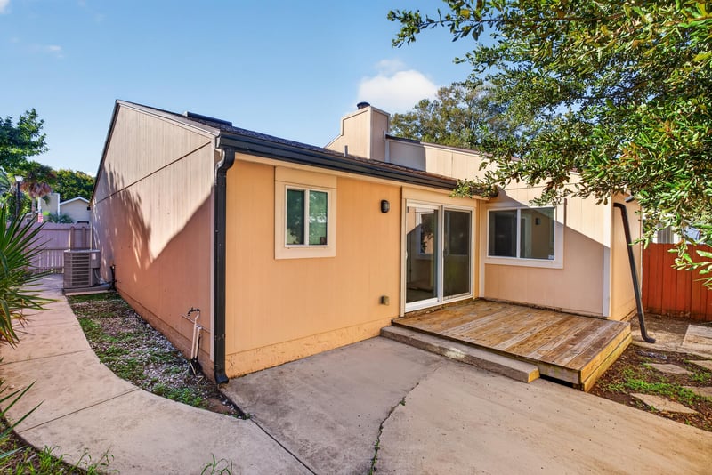 Rear deck with fenced side yard at 8177 Virgo St, Jacksonville, FL 32216