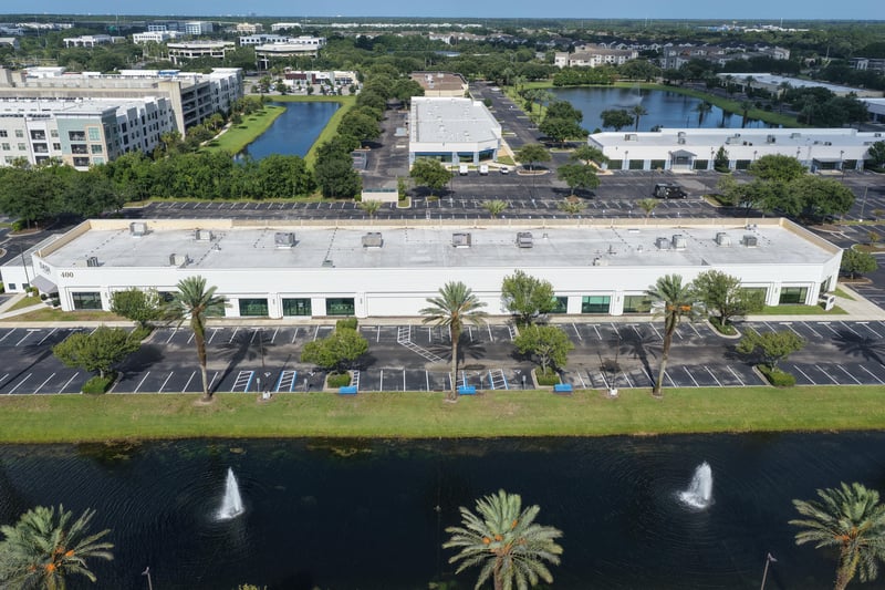 Aerial view of a roofline with multi-story building and ponds at 10550 Deerwood Park Blvd, Jacksonville, FL 32256