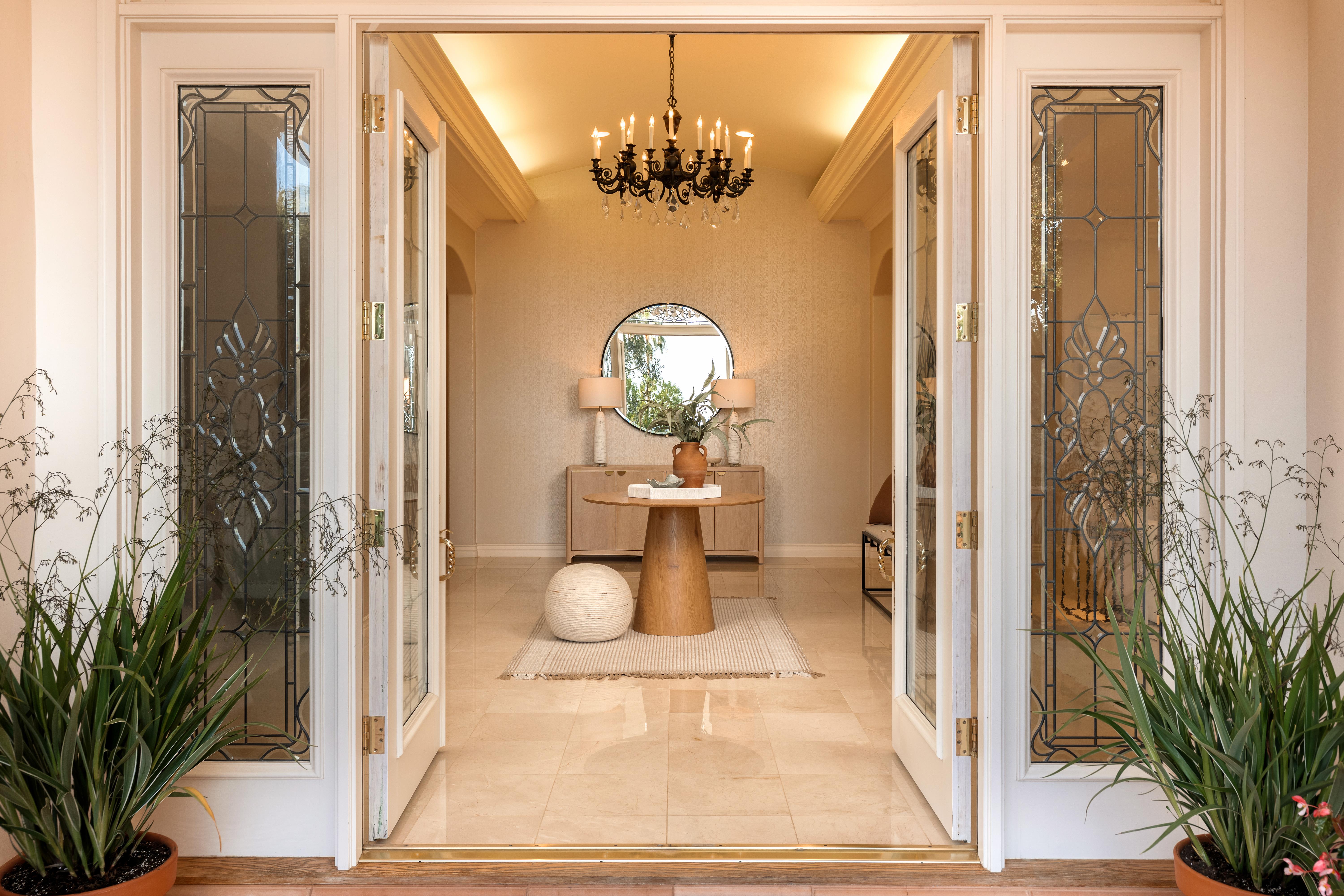 Interior living room photography at luxury Montecito-area estate, 450 El Cielito Rd, Santa Barbara — virtual real estate photography highlighting volume, natural light, and refined finishes with Channel Islands visible beyond. Our team captured still photography, aerial drone photography, twilight photography, a Matterport virtual tour, a 2D floor plan, and a custom property website from afternoon through twilight.