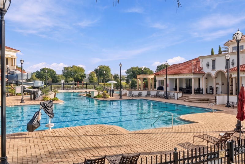 Community pool and clubhouse exterior in Murabella