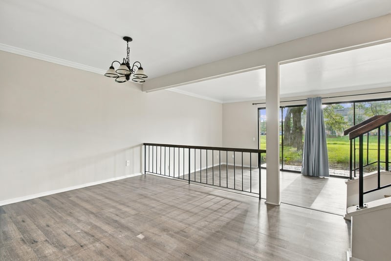 Living area with ceiling fan and open railing at 7703 Las Palmas Way