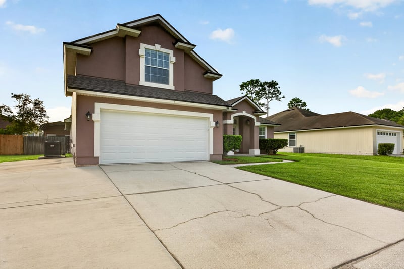 Front exterior with driveway and garage at 3112 Silverado Cir, Green Cove Springs, FL 32043