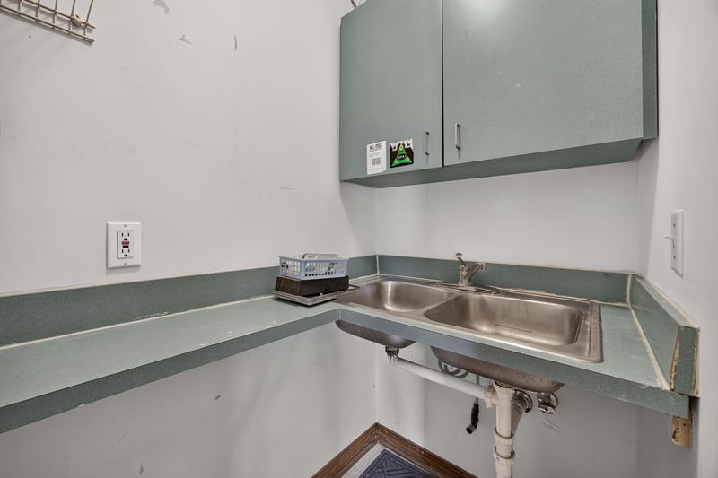 Utility counter with sink and overhead cabinets at 1543 Kingsley Ave #19, Orange Park, FL 32073