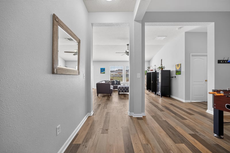 Entry hallway with mirror leading into the home at 2065 Creekmont Dr