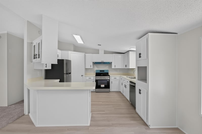 Kitchen with refrigerator and stove at 7603 Coach Park Dr, Jacksonville, FL 32244